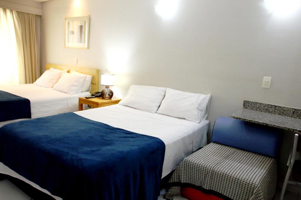 Postel nebo postele na pokoji v ubytování Flats em frente ao Allianz Parque - HOTEL EM PERDIZES