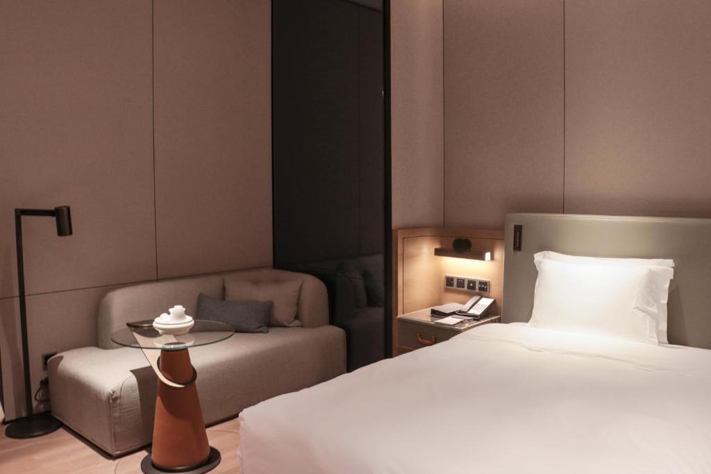 Postel nebo postele na pokoji v ubytování Crowne Plaza Chaozhou Riverside by IHG