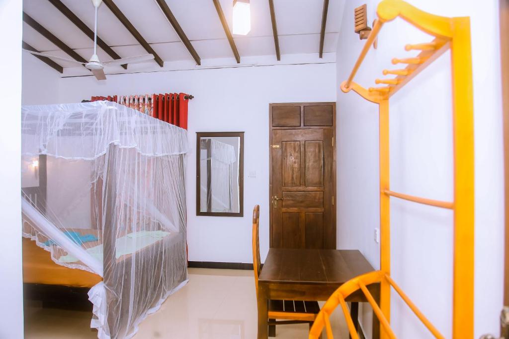 Postel nebo postele na pokoji v ubytování Brave resort Mirissa