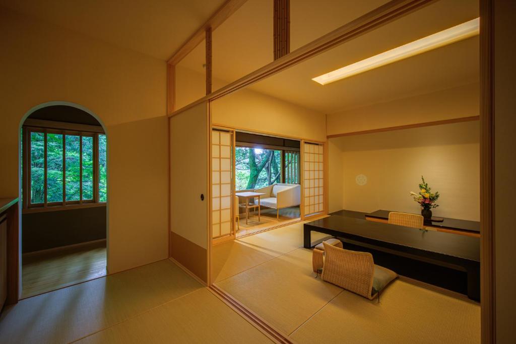 a living room with a couch and a table at Tsukihitei in Nara