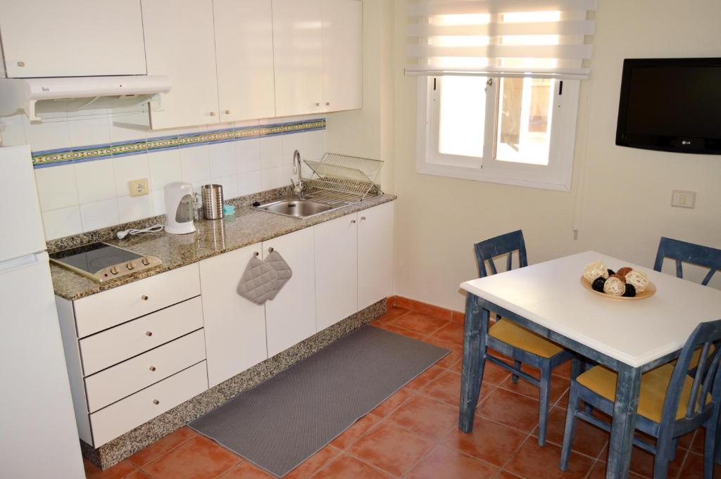 Kuchyň nebo kuchyňský kout v ubytování Arcade Apartments