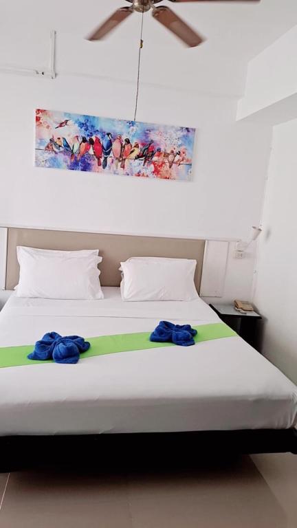 Postel nebo postele na pokoji v ubytování Boomerang Inn
