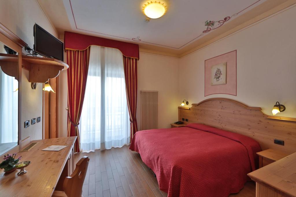 Łóżko lub łóżka w pokoju w obiekcie Hotel Fai