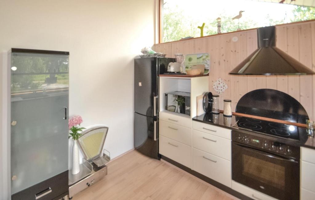 Kuchyň nebo kuchyňský kout v ubytování Holiday Home Grenaa 53 Denmark