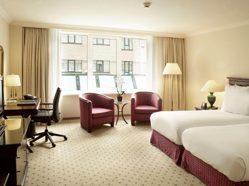 Postel nebo postele na pokoji v ubytování Hilton Antwerp Old Town