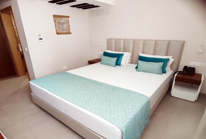 Postel nebo postele na pokoji v ubytování Luna Boutique Hotel
