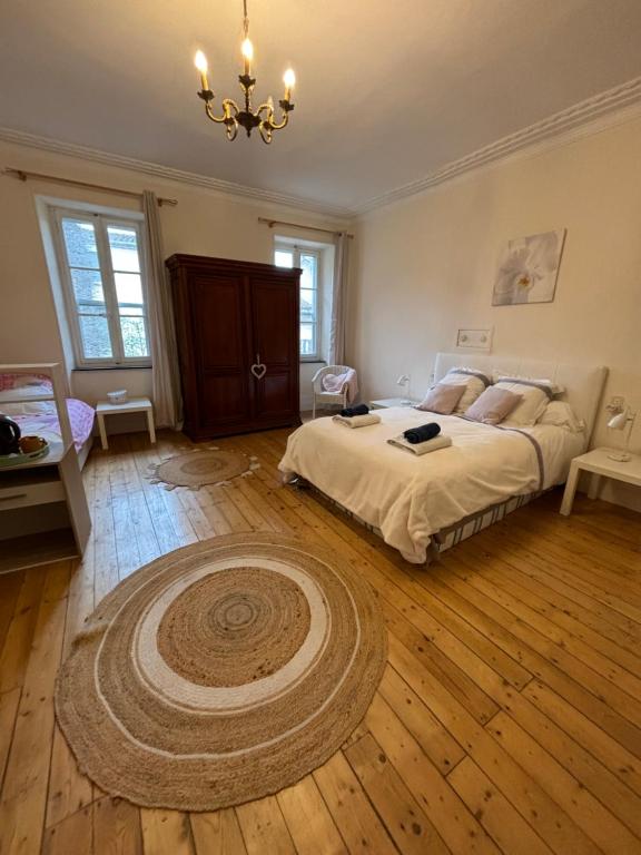 Cama o camas de una habitación en La Maison d'hôtes du Chapelier