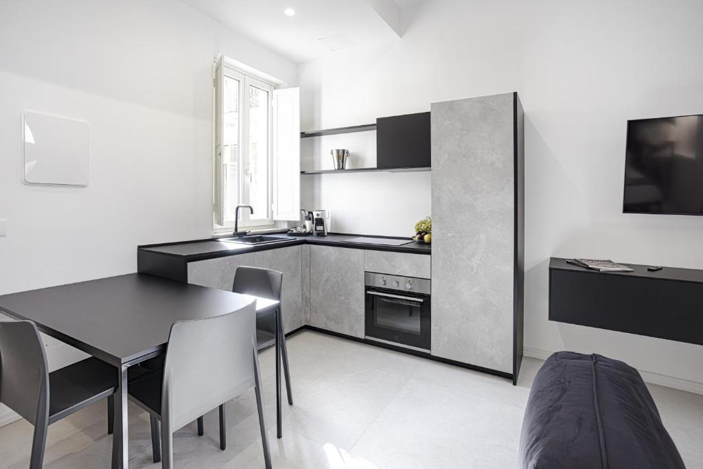 Kuchyň nebo kuchyňský kout v ubytování Nostos rooms & Apartments