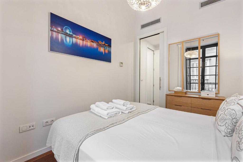 Łóżko lub łóżka w pokoju w obiekcie Stay U-nique Apartment Sebastián Souvirón