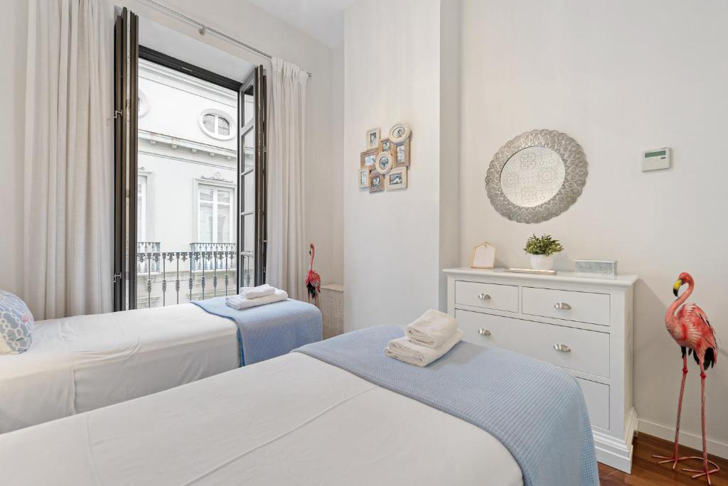 Łóżko lub łóżka w pokoju w obiekcie Stay U-nique Apartment Sebastián Souvirón