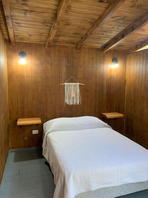 Postel nebo postele na pokoji v ubytování Refugio Ventana