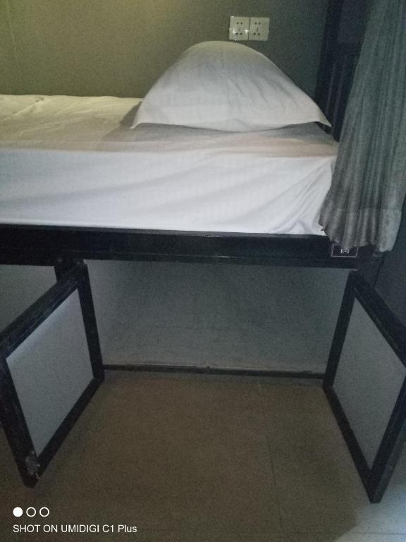 Postel nebo postele na pokoji v ubytování Hostel FUJI