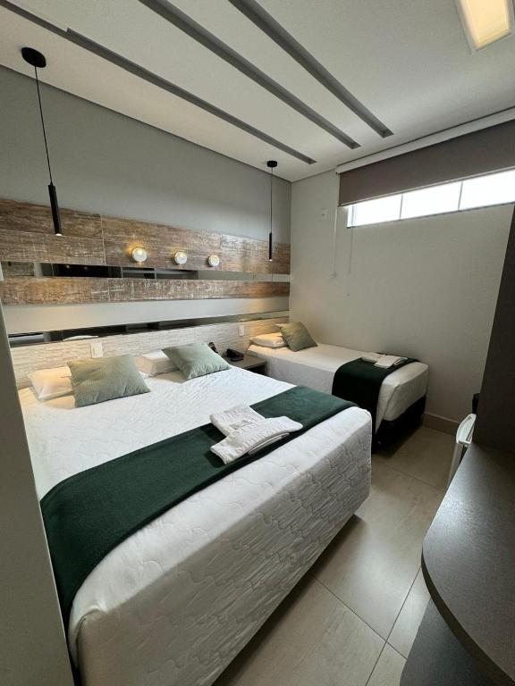 Postel nebo postele na pokoji v ubytování Hotel Imperatriz Premium
