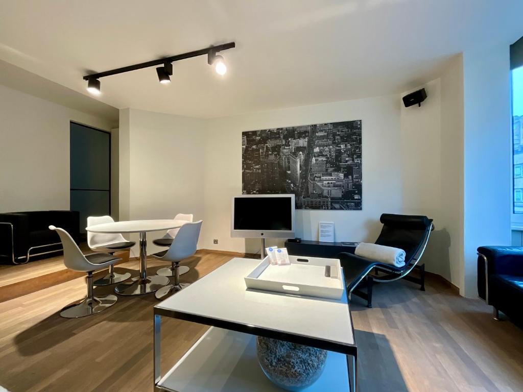 TV a/nebo společenská místnost v ubytování Les Dunes