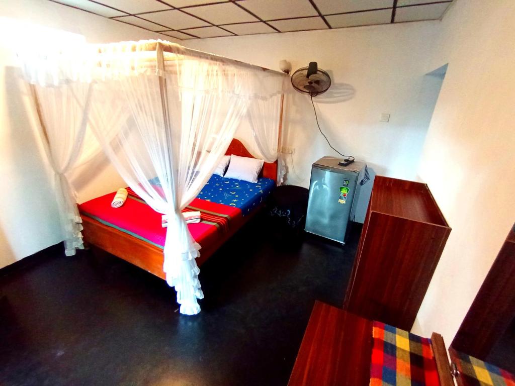 Postel nebo postele na pokoji v ubytování Sasaa Guest House