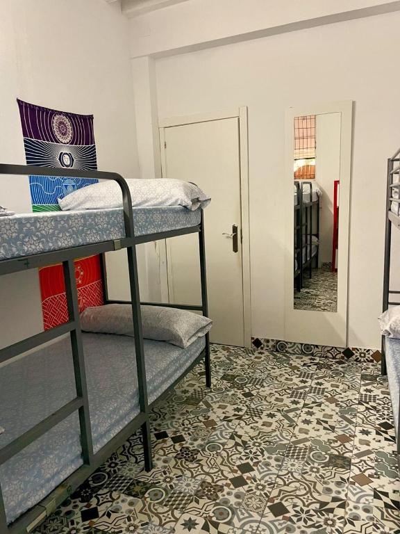 Postel nebo postele na pokoji v ubytování Rosa de los Vientos