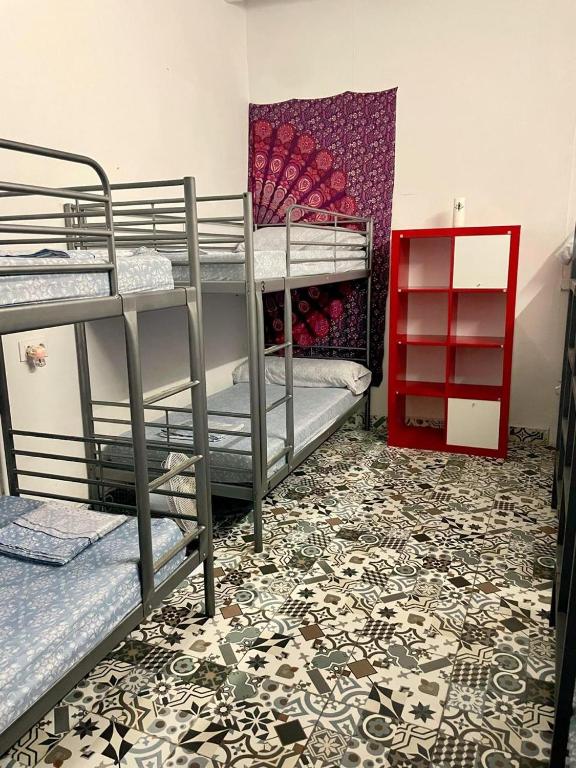 Postel nebo postele na pokoji v ubytování Rosa de los Vientos