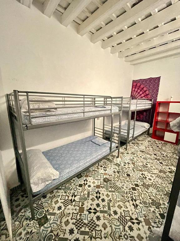 Postel nebo postele na pokoji v ubytování Rosa de los Vientos