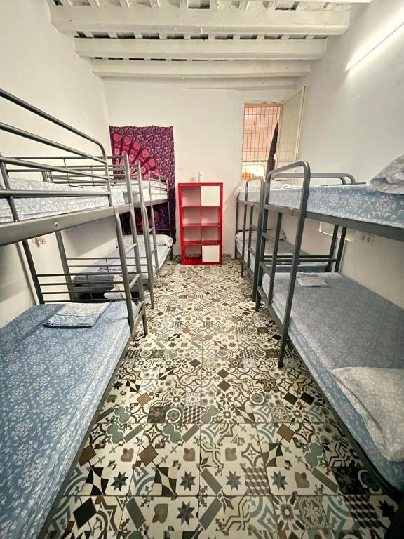 Postel nebo postele na pokoji v ubytování Rosa de los Vientos