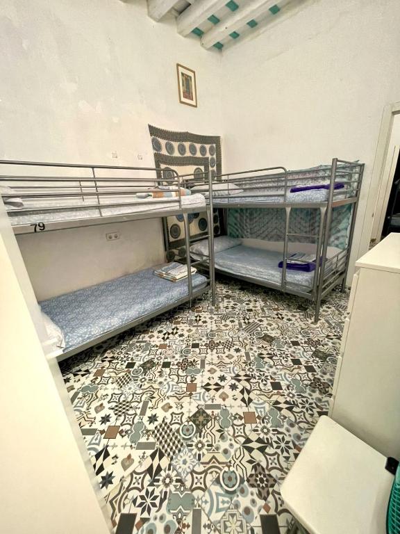 Postel nebo postele na pokoji v ubytování Rosa de los Vientos