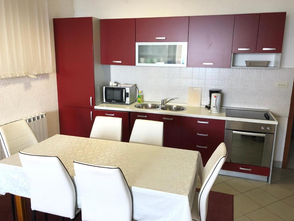 Kuchyňa alebo kuchynka v ubytovaní Vuke Apartments