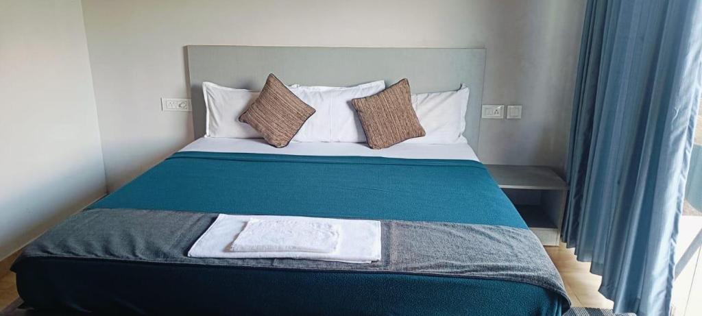 Postel nebo postele na pokoji v ubytování Rock View Resort