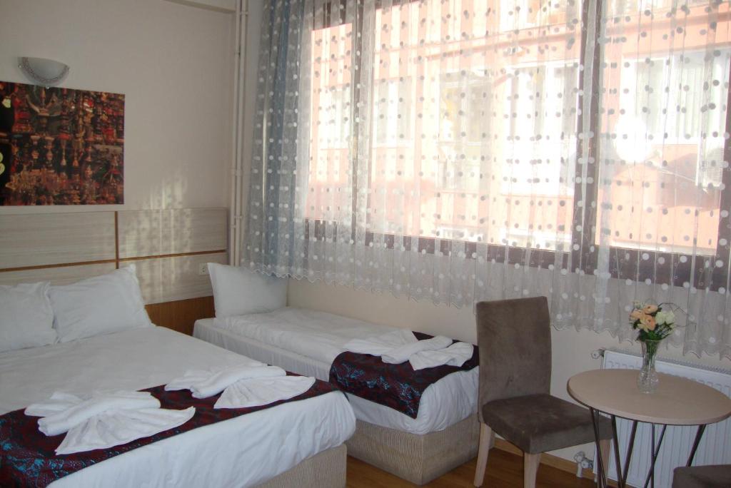 Postel nebo postele na pokoji v ubytování Royal Suites Besiktas