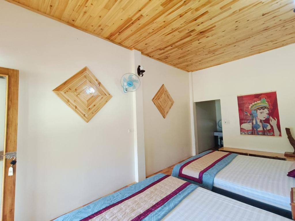 Postel nebo postele na pokoji v ubytování Moc's House