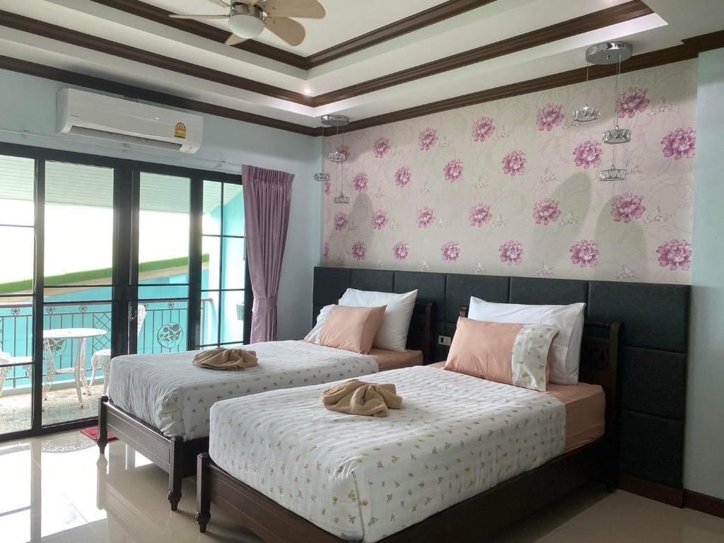 Letto o letti in una camera di TC villa on beach