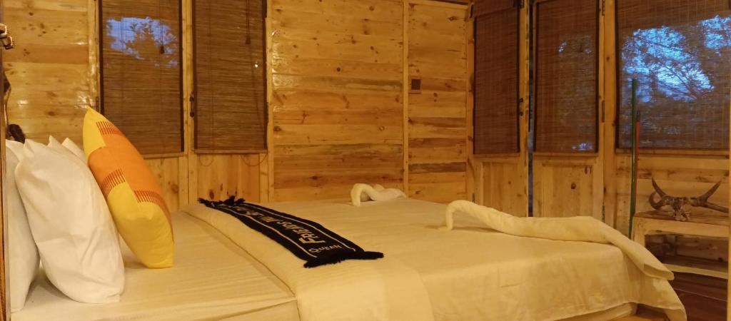 Postel nebo postele na pokoji v ubytování Mc Queen Homestay