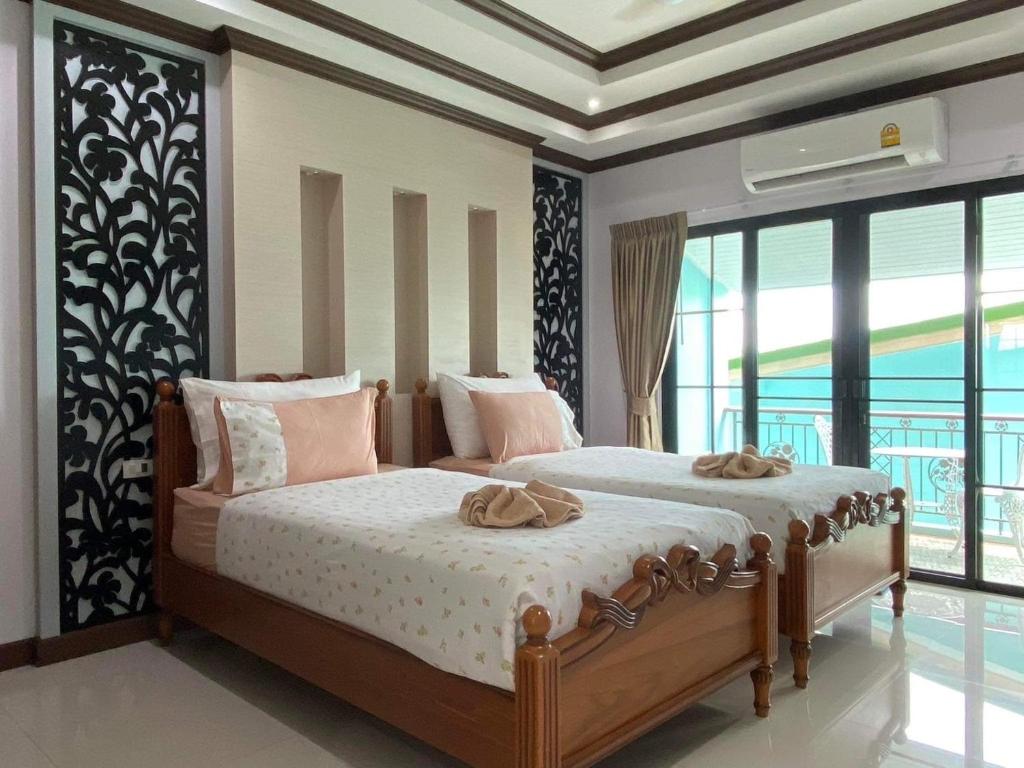 Letto o letti in una camera di TC villa on beach