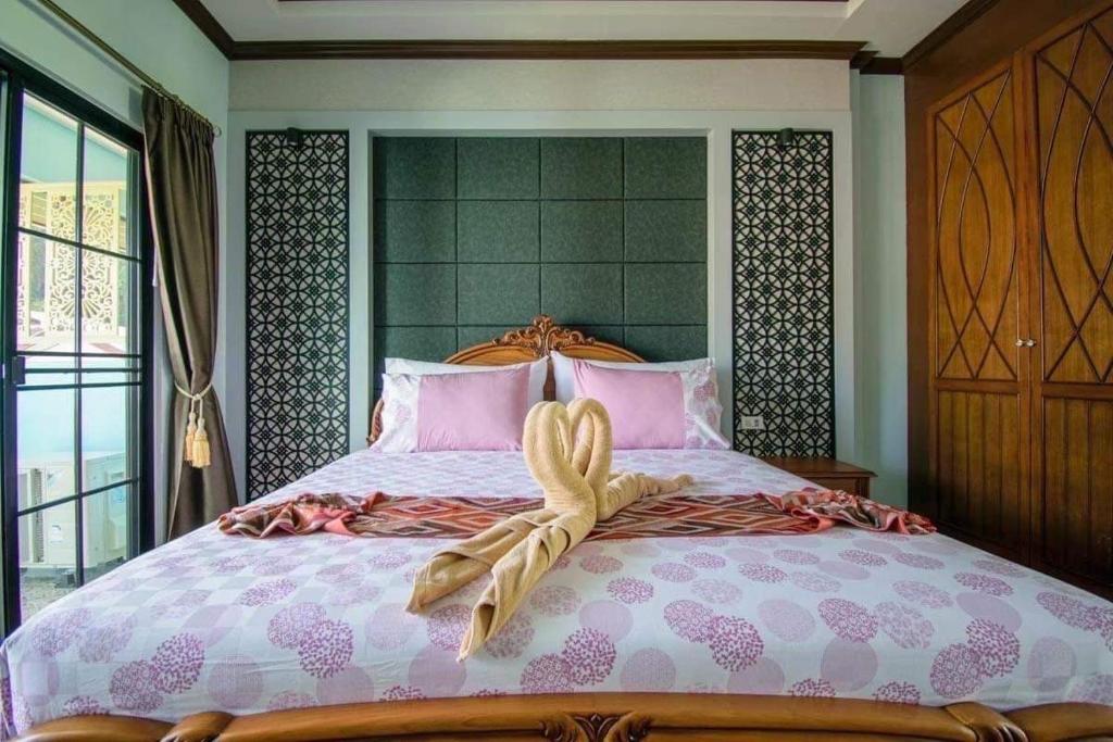 Letto o letti in una camera di TC villa on beach