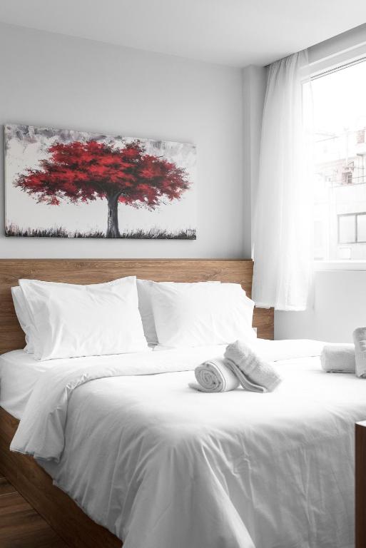 Posteľ alebo postele v izbe v ubytovaní Ultima, Nilie Hospitality MGMT