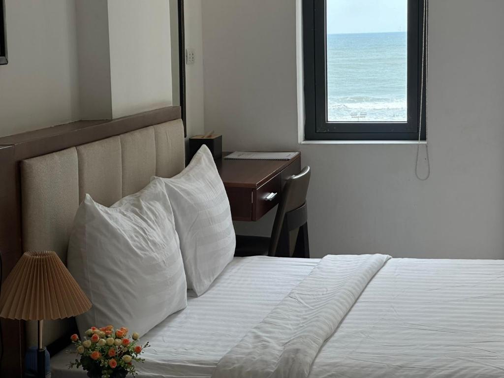 Postel nebo postele na pokoji v ubytování New Era Hotel & Apartments