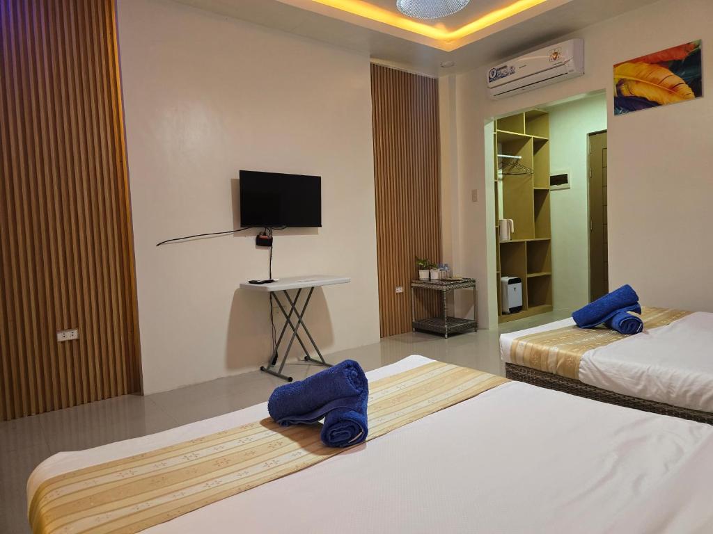 Postel nebo postele na pokoji v ubytování JADE RESORT - Bauang, La Union