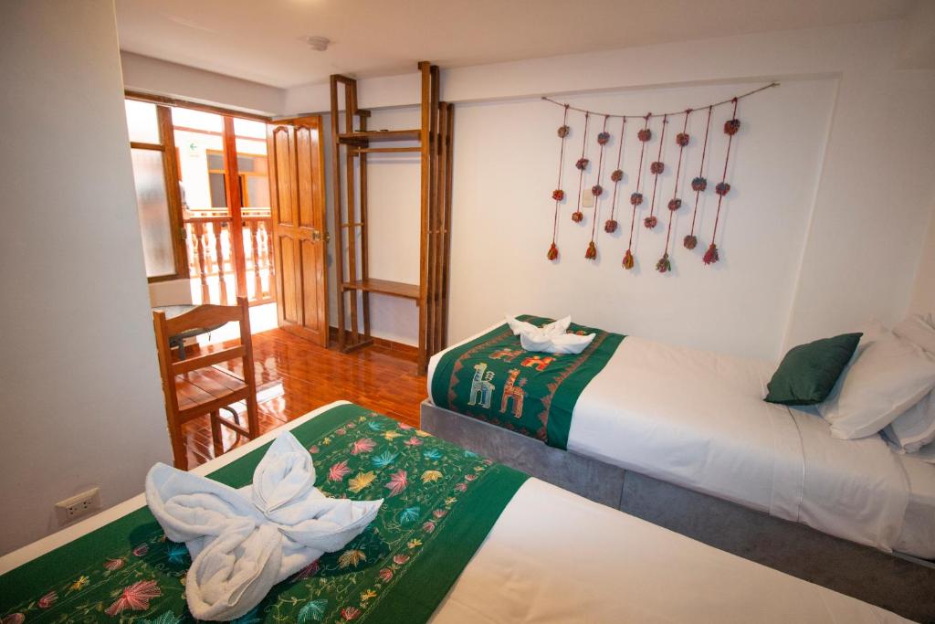 Postel nebo postele na pokoji v ubytování Munay Ñusta Cusco