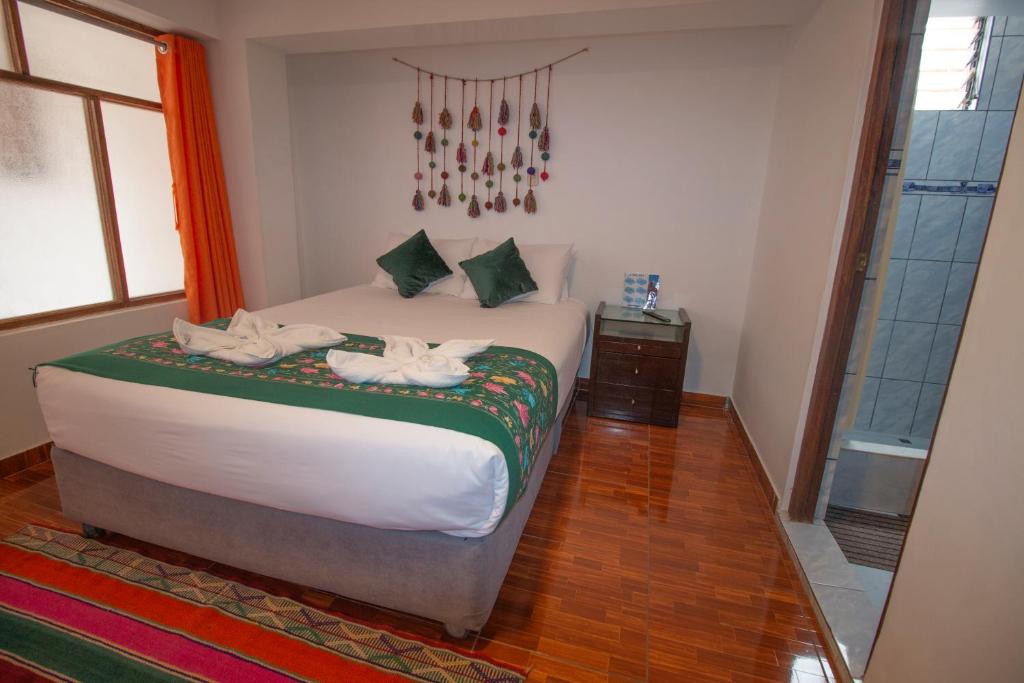 Postel nebo postele na pokoji v ubytování Munay Ñusta Cusco