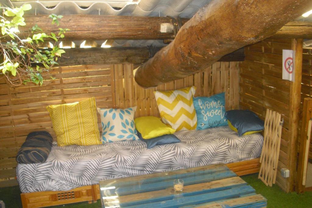 a couch sitting in the corner of a cabin at Lou mas li Pitchoun "La Lauze" in Gordes