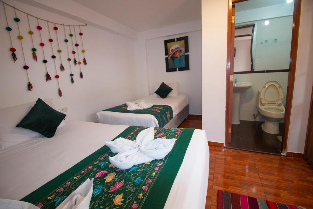 Postel nebo postele na pokoji v ubytování Munay Ñusta Cusco