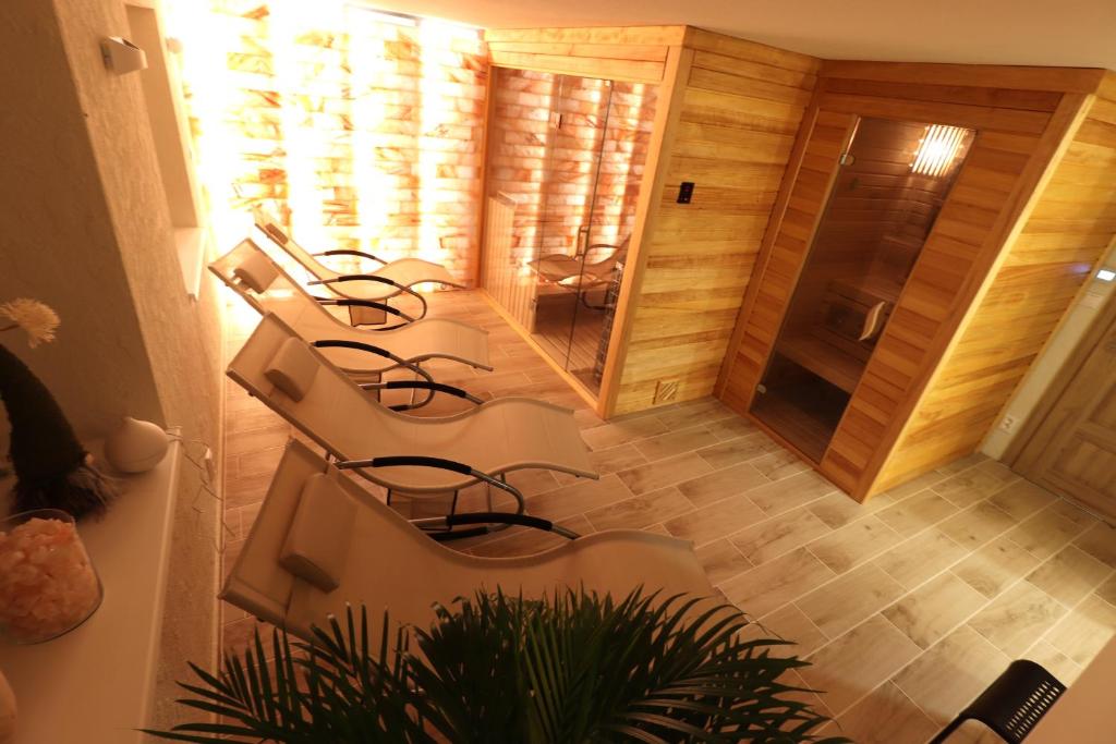 a group of chairs sitting in a room at Chata Matzo in Mýto pod Ďumbierom