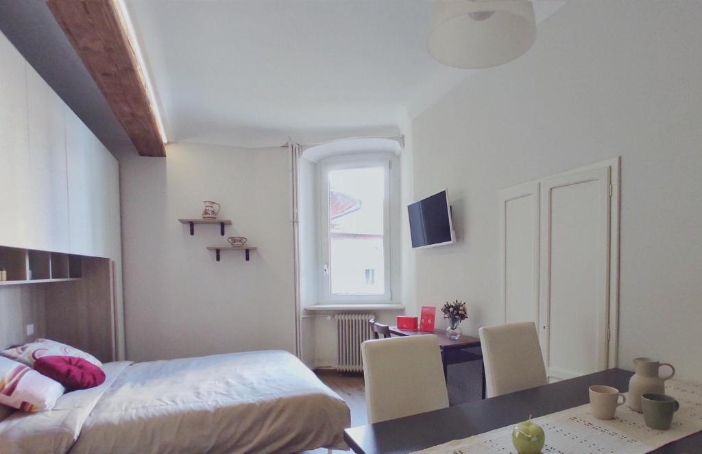 Televízia a/alebo spoločenská miestnosť v ubytovaní Conte Verde Apartments