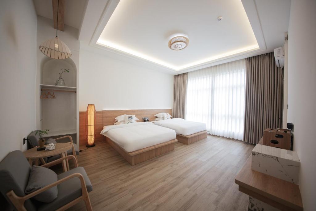 Postel nebo postele na pokoji v ubytování Meizhou Island Lijia Xiaoyuan B&B