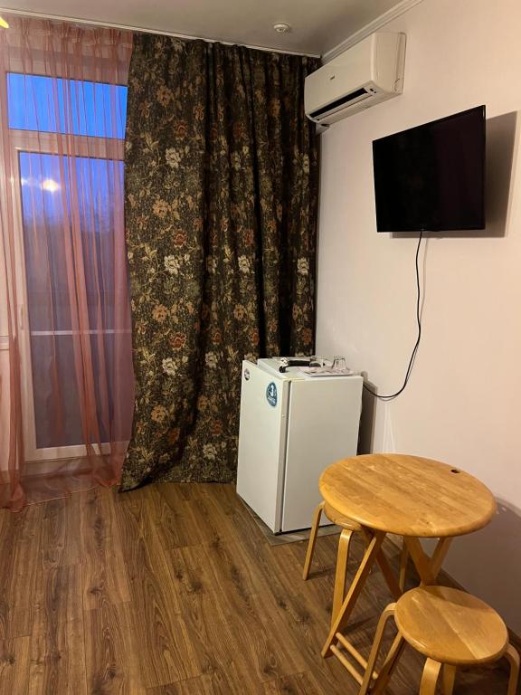 TV a/nebo společenská místnost v ubytování Adonis