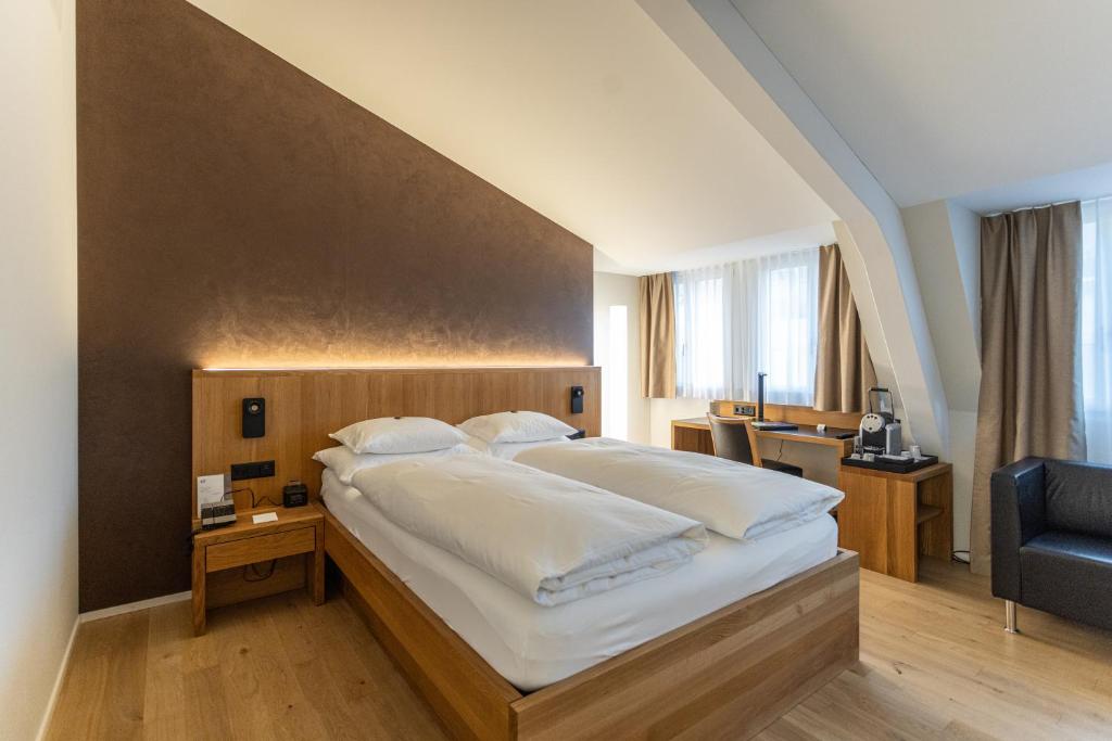 Postel nebo postele na pokoji v ubytování ABC Swiss Quality Hotel