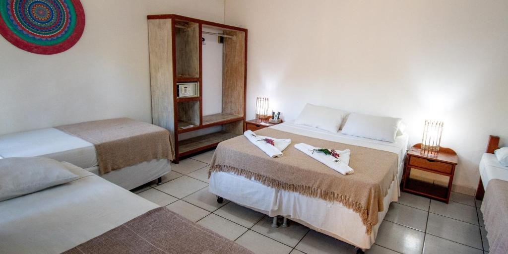 Postel nebo postele na pokoji v ubytování Pousada Arraial Candeia