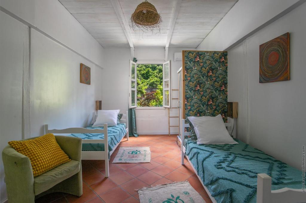 Postel nebo postele na pokoji v ubytování Maison Manman Dlo