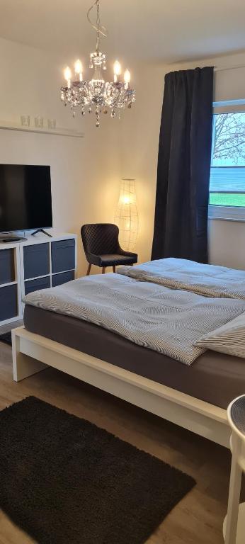 Postel nebo postele na pokoji v ubytování Mutti 's Haus -Zur Südheide