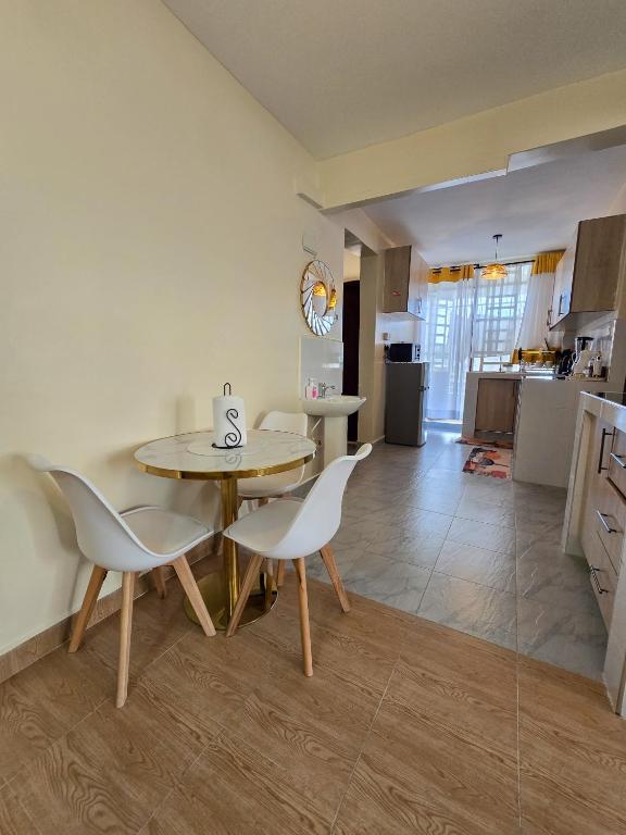Kuchyň nebo kuchyňský kout v ubytování Nyumbani Vibes - Treands Apartment