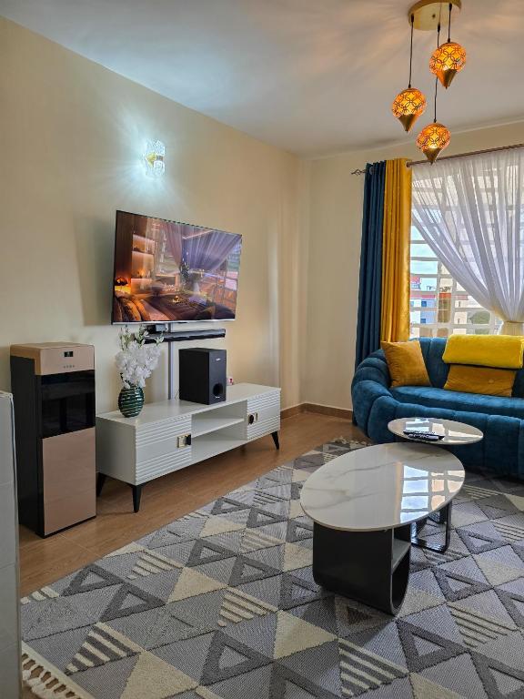 TV a/nebo společenská místnost v ubytování Nyumbani Vibes - Treands Apartment