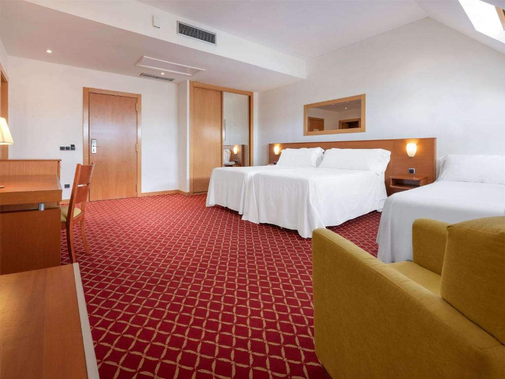 Postel nebo postele na pokoji v ubytování Hotel Zentral León